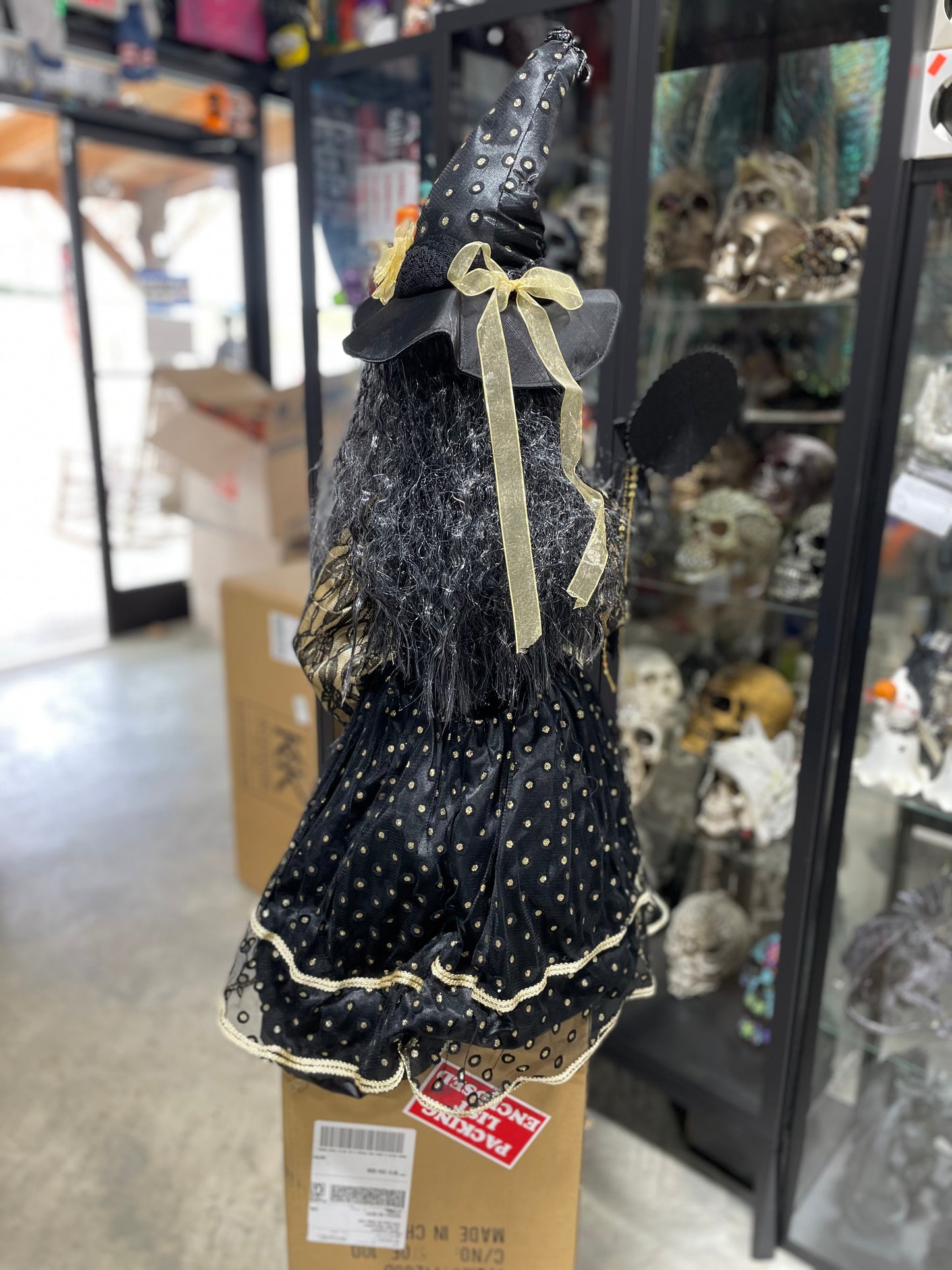 56 IN. CLARA SITTING WITCH W/ BLACK AND GOLD DOT DRESS