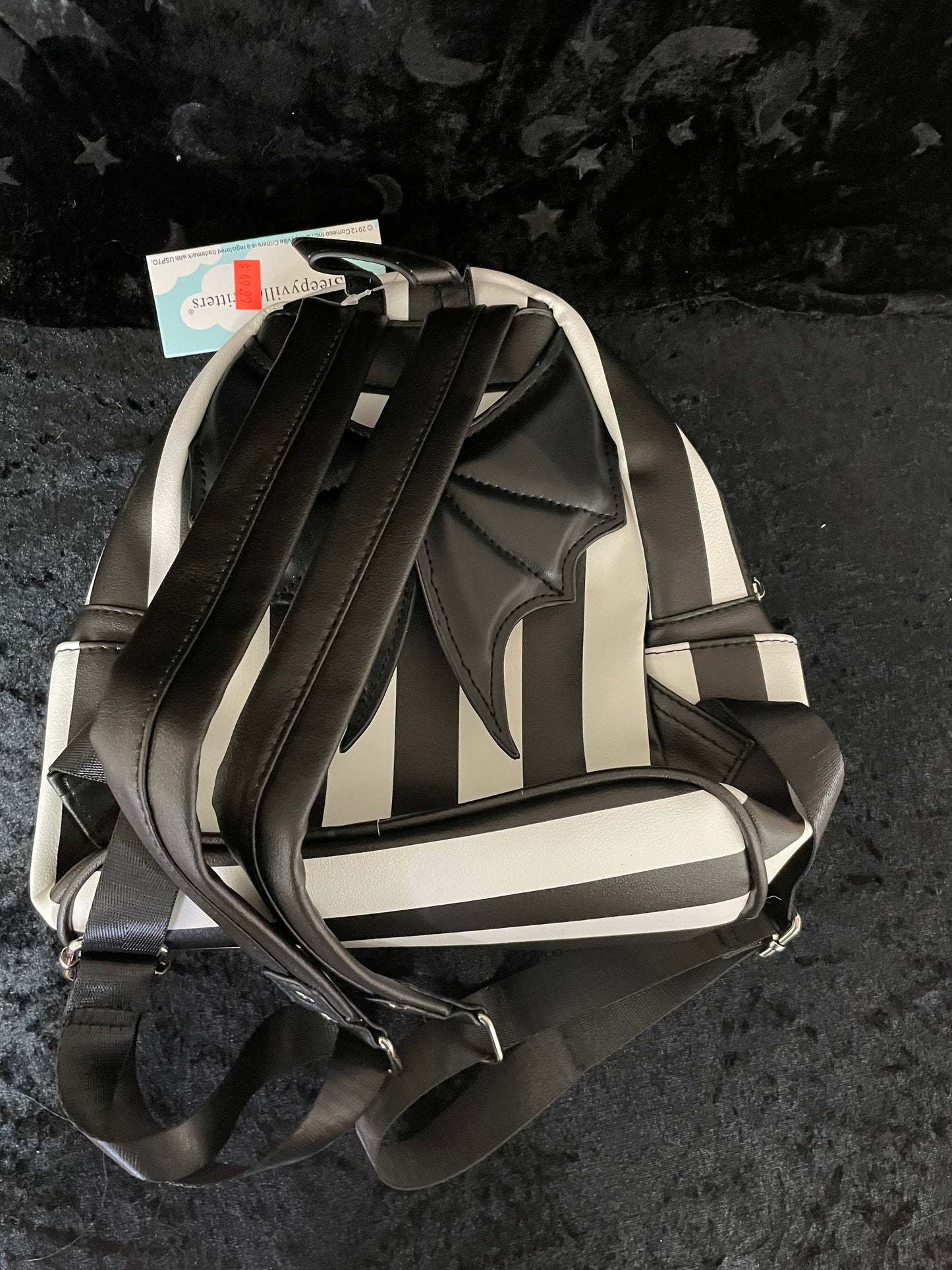 Black and White Pinstriped bat wing backpack