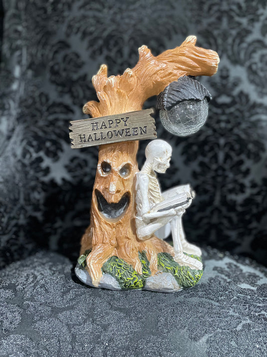 SKELETON AND TREE FIGURINE