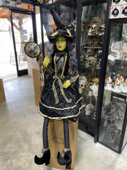 56 IN. CLARA SITTING WITCH W/ BLACK AND GOLD DOT DRESS